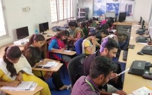 Students working at lab workstations during a practical session