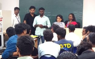 Trainers interacting with learners during a session